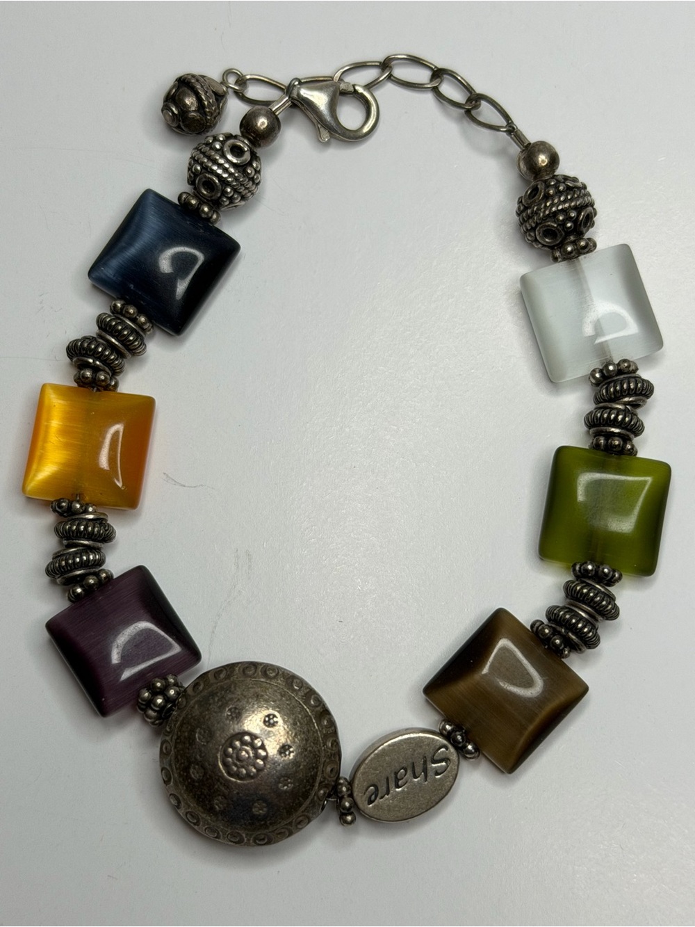 Sterling Silver Bali  
Multicolor Optic Glass Bead Share
Bracelet